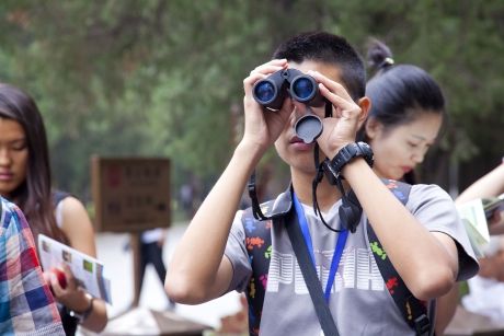 Man using binoculars in Beijing