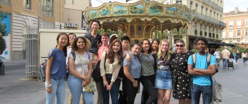 High school students in front of a carousel in Toulouse