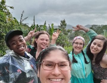 Students taking a group selfie in Monteverde forest